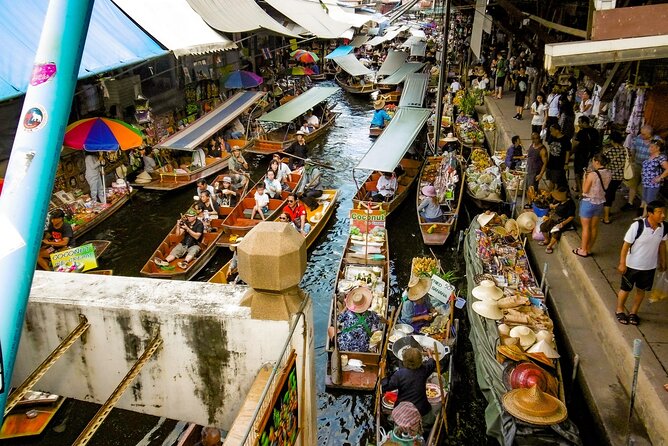 Maeklong Railway, Sugar Palm Factory & Floating Market - A train that cuts through the market