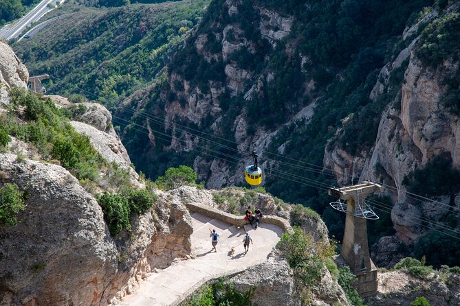 Montserrat Tour with Cogwheel Train, Monastery & Black Madonna - Free time, the Santa Cueva, and the harder walks