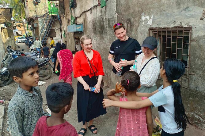 Mumbai Slum Tour with Dhobi Ghat Laundry & Train Ride Tour - Practical tips for a respectful visit
