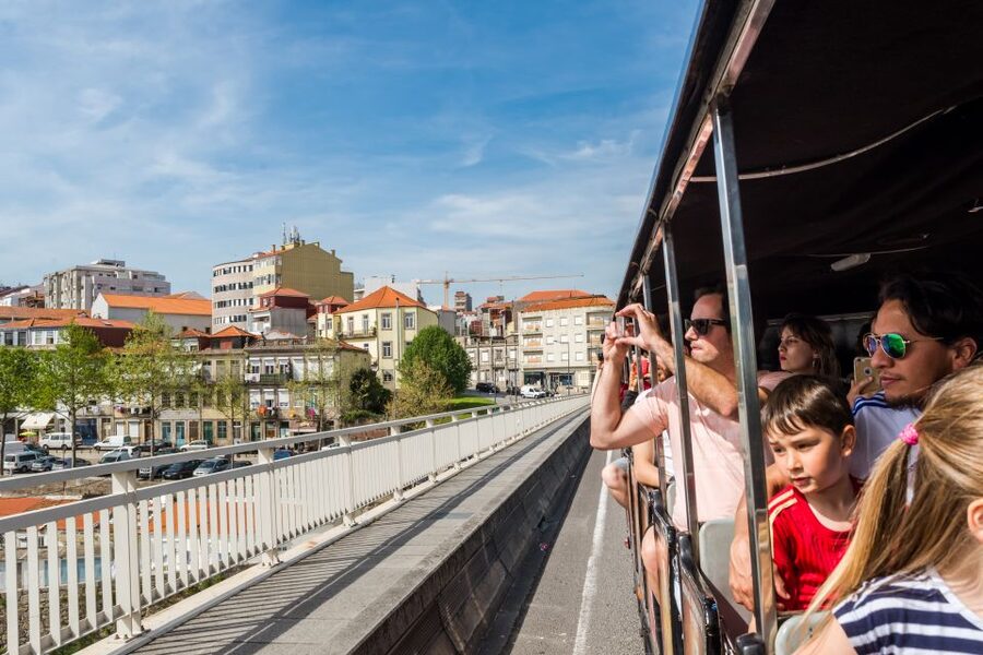 Porto: City Train Tour, River Cruise & Wine Cellar - Exchanging your voucher beside Porto Cathedral