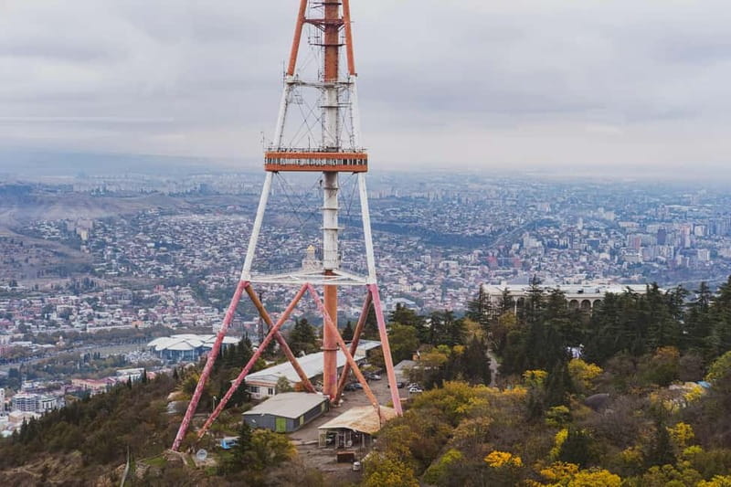 Tbilisi: Old Town Sights & Funicular Ride to Mtatsminda Park - Taking the cable car to Narikala Castle